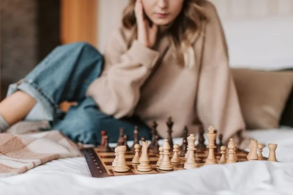 woman playing chess